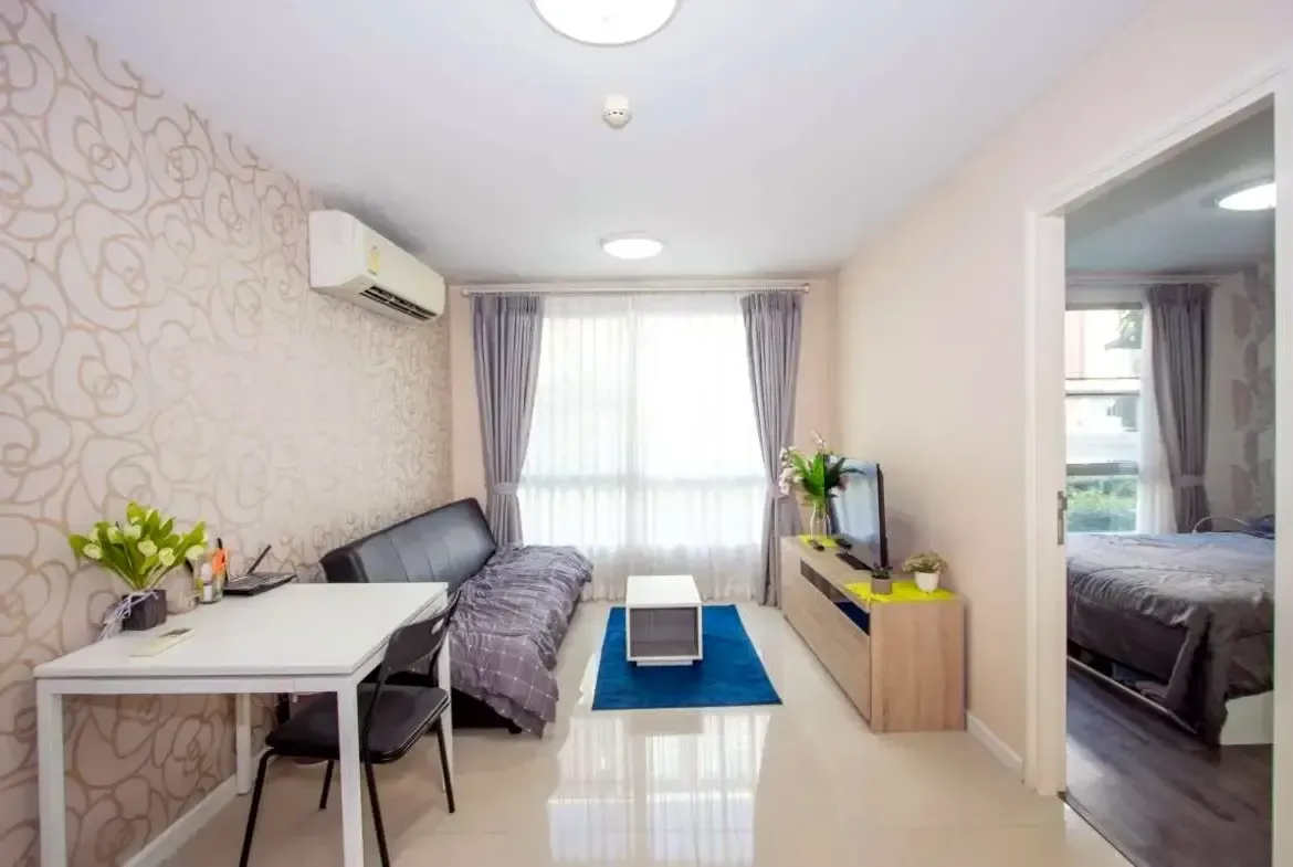 Comfortable living area with sofa and wooden dining table